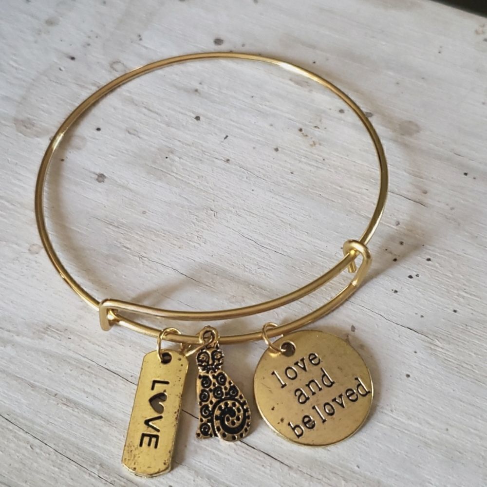 Bracelets by Sandra gold tone adjustable, Love